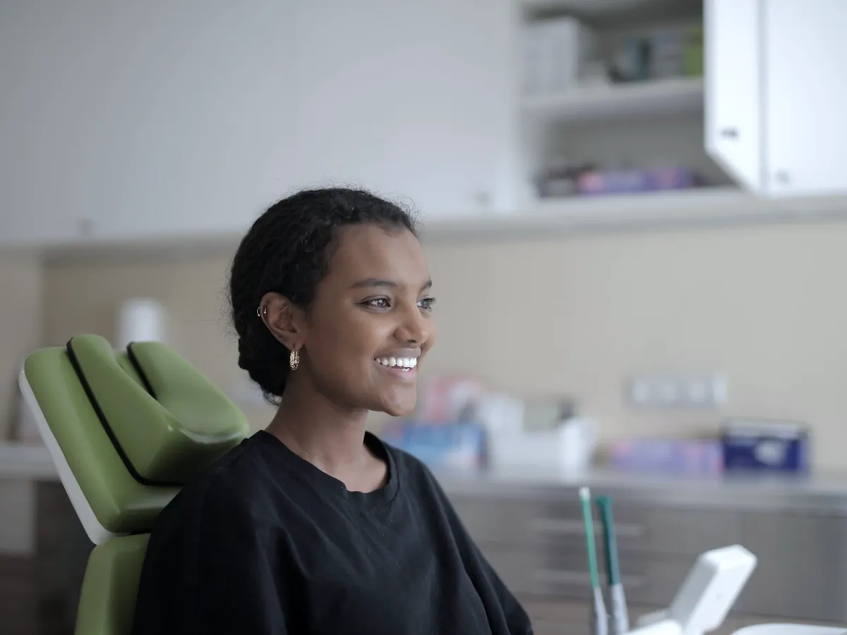 Smiling patient sitting in a dental chair